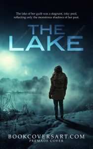 The Lake psychological mystery thriller book cover featuring a lone figure standing by a fog-covered lake.